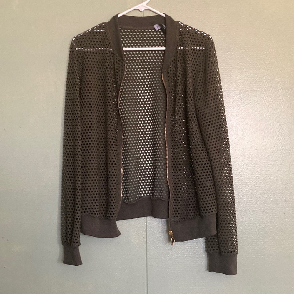geeen jacket with holes!